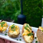 Double stuffed potatoes on a white plate