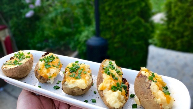 Double stuffed potatoes on a white plate