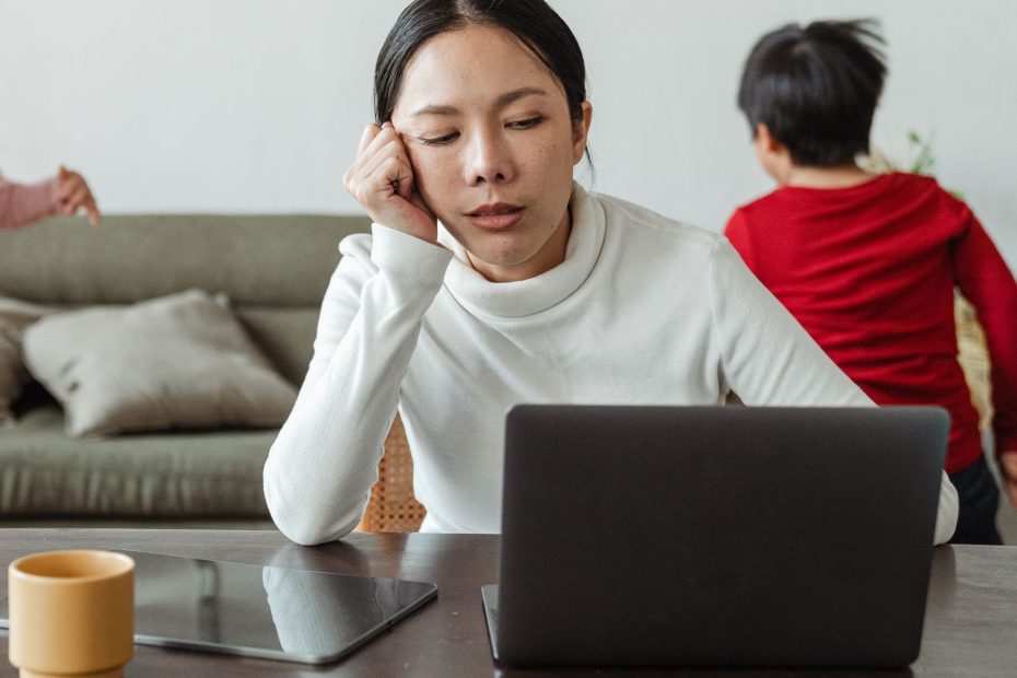 Coffee, notebook and laptop computer on a wood desk