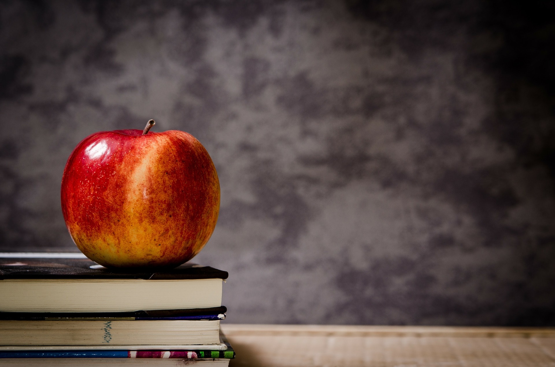 Apple on a stack of books