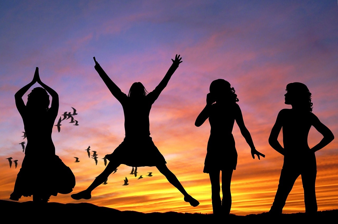 Silhouette of four women against the sunset