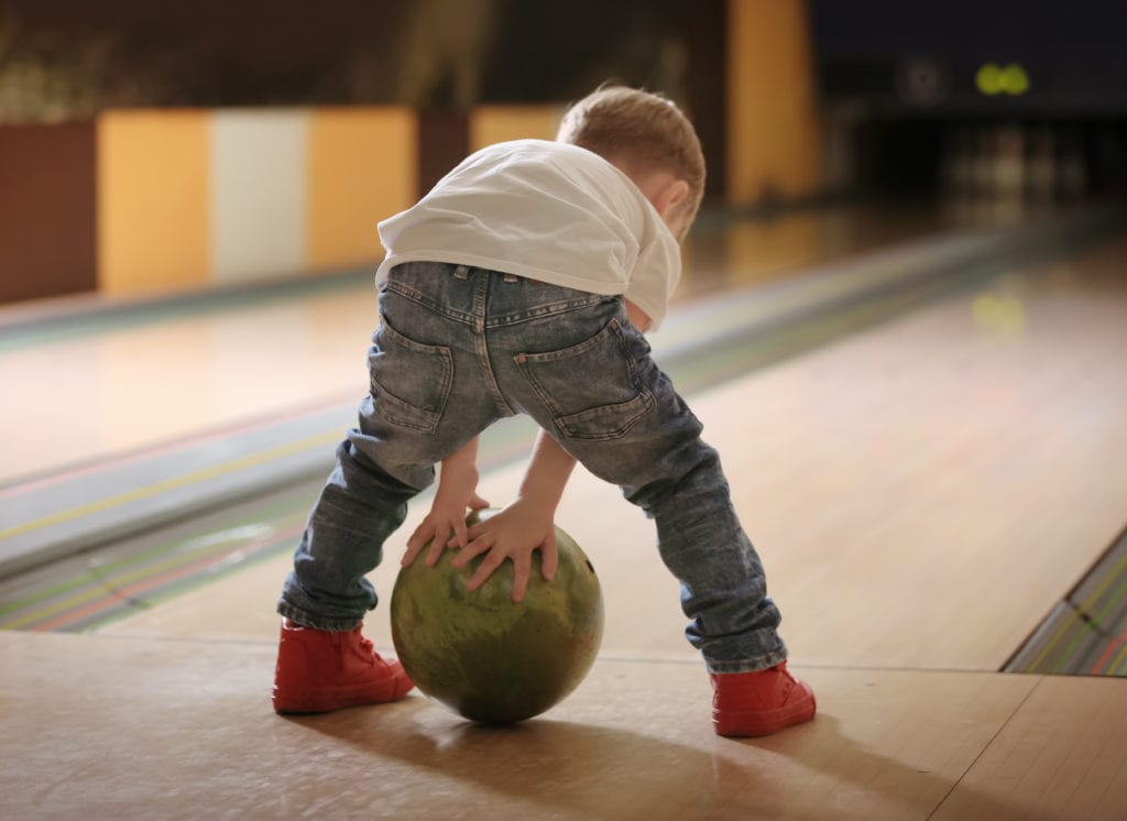 Young boy Bowling for Free in Alberta