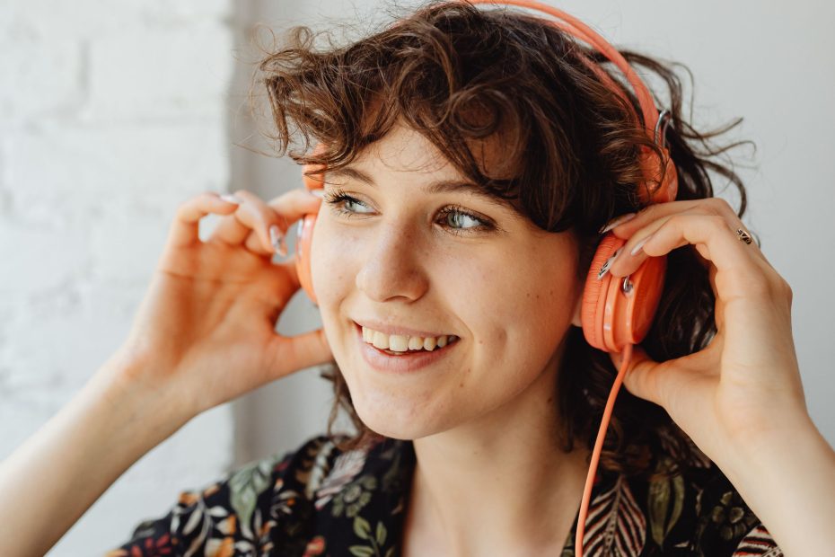 Woman with headphones around her neck