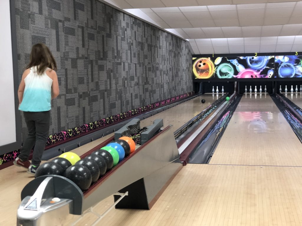 Tween girl playing 5-pin at Westlock Bowl